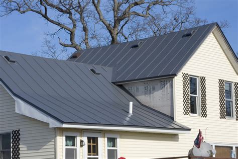 white house with charcoal gray metal roof|dark gray white house roof.